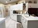 Well-equipped kitchen with white cabinets, stainless steel appliances, and ample counter space at 7225 Cedar Hollow Cir # 20-201, Bradenton, FL 34203
