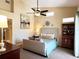 Spacious main bedroom with high ceilings, a king-size bed and a large dresser at 7225 Cedar Hollow Cir # 20-201, Bradenton, FL 34203