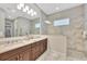 Bathroom boasts double sinks, a large shower, and modern finishes at 7240 Whittlebury Trl, Bradenton, FL 34202