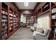 Well-lit library featuring bookshelves and comfortable seating at 7584 Andora Dr, Sarasota, FL 34238