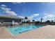 Community pool with brick patio and lounge chairs at 924 Sandpiper Cir # 0, Bradenton, FL 34209