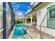 Screened pool and patio with access to the house at 1049 River Wind Cir, Bradenton, FL 34212