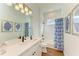 White bathroom with a bathtub, shower, and modern vanity at 1049 River Wind Cir, Bradenton, FL 34212