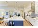 Gourmet kitchen with large island, quartz countertops, and stainless steel appliances at 1049 River Wind Cir, Bradenton, FL 34212