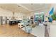 Open living room and kitchen with hardwood floors, light walls, and modern furnishings at 1049 River Wind Cir, Bradenton, FL 34212