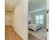 Long hallway with hardwood floors leading to a bedroom at 1049 River Wind Cir, Bradenton, FL 34212