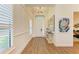 Bright and airy entryway with wood floors and plantation shutters at 1049 River Wind Cir, Bradenton, FL 34212