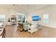 Spacious living room with hardwood floors, a large TV, and comfortable seating at 1049 River Wind Cir, Bradenton, FL 34212