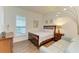 Small bedroom with a full-size bed, dresser and sofa at 1049 River Wind Cir, Bradenton, FL 34212
