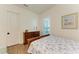 Bedroom with a double bed, dresser, and wood floors at 1049 River Wind Cir, Bradenton, FL 34212