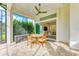Screened patio with dining table and access to the backyard at 1049 River Wind Cir, Bradenton, FL 34212