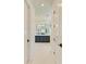 Elegant bathroom with double vanity, marble flooring, and a large walk-in shower at 1049 River Wind Cir, Bradenton, FL 34212