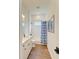 Clean bathroom with a shower/tub combo and wood-look tile floor at 1049 River Wind Cir, Bradenton, FL 34212