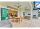 Relaxing outdoor patio with seating area, dining set, and built-in grill at 1049 River Wind Cir, Bradenton, FL 34212