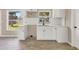 Newly remodeled kitchen featuring white shaker cabinets and subway tile backsplash at 105 Sylvania Ave, Englewood, FL 34223