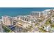 Stunning aerial view of beachfront condos, beachfront access, and well-maintained landscaping at 1102 Benjamin Franklin Dr # 409, Sarasota, FL 34236