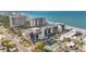 Aerial view of beachfront condos, tennis courts, and the beautiful blue Gulf at 1102 Benjamin Franklin Dr # 409, Sarasota, FL 34236