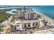 Panoramic aerial view shows beachfront condos, the beach, and the beautiful Gulf at 1102 Benjamin Franklin Dr # 409, Sarasota, FL 34236