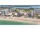 Scenic aerial view showcasing a beachside condo community along a beautiful coastline at 1102 Benjamin Franklin Dr # 409, Sarasota, FL 34236