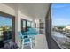 This cozy screened balcony has stylish outdoor seating overlooking beautiful blue ocean views at 1102 Benjamin Franklin Dr # 409, Sarasota, FL 34236