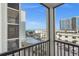 Balcony ocean view of nearby buildings and beach at 1102 Benjamin Franklin Dr # 409, Sarasota, FL 34236