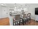 Beautiful kitchen features stainless steel appliances, granite counters, modern lighting, and breakfast bar with seating at 1102 Benjamin Franklin Dr # 409, Sarasota, FL 34236