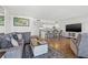 Bright and open living area with comfortable seating, wood-look floors, and views of the modern kitchen at 1102 Benjamin Franklin Dr # 409, Sarasota, FL 34236