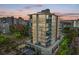 Modern high-rise building with city views at sunset at 111 Golden Gate Pt # 402, Sarasota, FL 34236