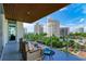 Spacious balcony with city views and seating area at 111 Golden Gate Pt # 402, Sarasota, FL 34236