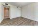 Spacious bedroom with large closet and wood-look floors at 111 Golden Gate Pt # 402, Sarasota, FL 34236