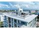 Modern rooftop deck with city views and lounge area at 111 Golden Gate Pt # 402, Sarasota, FL 34236