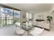 Spacious living room features a comfortable sofa and large windows with city views at 111 Golden Gate Pt # 402, Sarasota, FL 34236