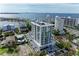 Modern building with pool and water views at 111 Golden Gate Pt # 402, Sarasota, FL 34236