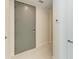 Contemporary entryway featuring a sleek gray door at 111 Golden Gate Pt # 402, Sarasota, FL 34236