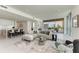 Open concept living room and kitchen area at 111 Golden Gate Pt # 402, Sarasota, FL 34236