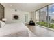 Bright bedroom with king-size bed and large window showcasing city views at 111 Golden Gate Pt # 402, Sarasota, FL 34236