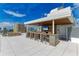 Outdoor kitchen and seating area on the rooftop terrace at 111 Golden Gate Pt # 402, Sarasota, FL 34236