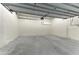 Spacious, bright garage interior with high ceilings at 111 Golden Gate Pt # 402, Sarasota, FL 34236