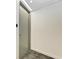 Modern entryway with gray door and textured wall at 111 Golden Gate Pt # 402, Sarasota, FL 34236
