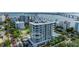 Aerial view of a modern high-rise building near the water at 111 Golden Gate Pt # 402, Sarasota, FL 34236