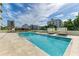 Expansive pool and patio with plenty of seating at 111 Golden Gate Pt # 402, Sarasota, FL 34236