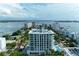 Modern high rise building with a pool and water views at 111 Golden Gate Pt # 402, Sarasota, FL 34236