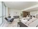 Open concept living room with city views at 111 Golden Gate Pt # 402, Sarasota, FL 34236