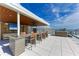 Outdoor kitchen and bar on rooftop terrace with amazing views at 111 Golden Gate Pt # 402, Sarasota, FL 34236