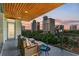 Relaxing balcony with city views and seating area at 111 Golden Gate Pt # 402, Sarasota, FL 34236