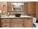 Unique bathroom with a decorative stone sink, custom vanity, and a natural, rustic aesthetic at 117 Hillcrest Dr, Bradenton, FL 34209