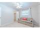 Comfortable bedroom featuring a couch, window, and closet space, perfect for relaxation at 117 Hillcrest Dr, Bradenton, FL 34209