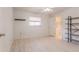 Bright bedroom with a large window, closet, and shelving offering ample storage space at 117 Hillcrest Dr, Bradenton, FL 34209