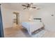 Cozy bedroom with a ceiling fan and ensuite bathroom access, creating a convenient layout at 117 Hillcrest Dr, Bradenton, FL 34209