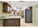 Modern kitchen featuring stainless steel appliances, granite countertops, and generous cabinet space at 117 Hillcrest Dr, Bradenton, FL 34209